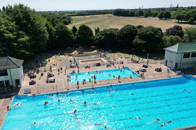 People enjoy the hot weather as they swim at Peterborough Lido in Peterborough, Cambridgeshire. Monday is set to be one of the hottest June days on record, with highs of 34C as much of England enters a fourth day of a heatwave. Picture date: Monday June 30, 2025. PA Photo. Photo credit should read: Joe Giddens/PA Wire