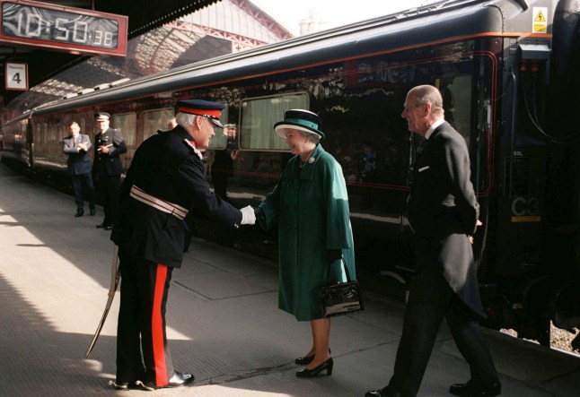BRISTOL, UNITED KINGDOM - APRIL 01: The Queen And Prince Philip is greeted by the Lord Lieutenant upon Arriving On The Royal Train For The Maundy Service At Bristol Cathedral. (Photo by Tim Graham Photo Library via Getty Images)