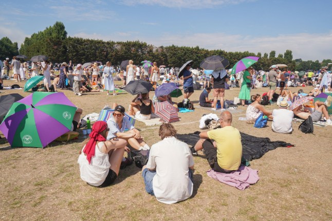 Alamy Live News. 3BN937H London, UK. 1 July 2025. Most people are in goos spirits despite queuing in the scorching heat in Wimbledon Park on Day 2 of the Wimbledon tennis Championships after the hottest opening day was recorded on Monday. . Amer Ghazzal/Alamy Live News This is an Alamy Live News image and may not be part of your current Alamy deal . If you are unsure, please contact our sales team to check.