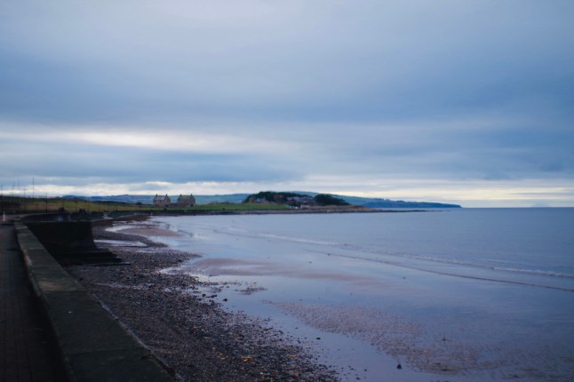 By the seaside in Scotland. Prestwick is a long, mostly sandy beach, with some pebbles, offering excellent views out over the Firth of Clyde across to the mountainous Isle of Arran.