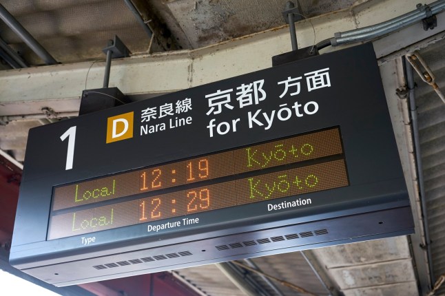 Train times outside of Kyoto train station.
