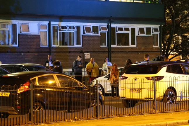 A major emergency response is underway in South East London following a fatal fire at a block of maisonettes on Lewisham Road, Ladywell, during the early hours of Wednesday morning. Fatal 10-Pump Fire in Lewisham Prompts Major Emergency Response and Investigation The London Fire Brigade (LFB) confirmed that ten fire engines and around 70 firefighters were called to tackle the intense blaze, which broke out just before midnight. The fire engulfed part of a five-room maisonette split across the ground and first floors. Control Officers received the first of 14 emergency calls at 11:55pm, dispatching crews from Greenwich, Lewisham, Lee Green and surrounding stations. The incident was declared under control at 2:02am ??? more than two hours after it began. Fatal 10-Pump Fire in Lewisham Prompts Major Emergency Response and Investigation Confirmed Fatalities and Ongoing Investigation Tragically, lives have been lost in the incident. The exact number of fatalities has not yet been confirmed, and formal identification of the deceased is pending. Fatal 10-Pump Fire in Lewisham Prompts Major Emergency Response and Investigation A crime scene remains in place around the property, and Lewisham Road is closed between Penrose Way and Lewisham Hill as investigations continue. Fatal 10-Pump Fire in Lewisham Prompts Major Emergency Response and Investigation A joint probe between the LFB???s specialist fire investigators and Metropolitan Police is now underway to determine the cause. The fire has been classified as a Level Two hazardous incident, with forensic officers expected to remain at the site throughout the day and possibly into the night. Fatal 10-Pump Fire in Lewisham Prompts Major Emergency Response and Investigation Local Impact Nearby residents have been evacuated as a safety precaution, with emergency housing support being coordinated by Lewisham Council. London Ambulance Service units were also in attendance during the overnight response.