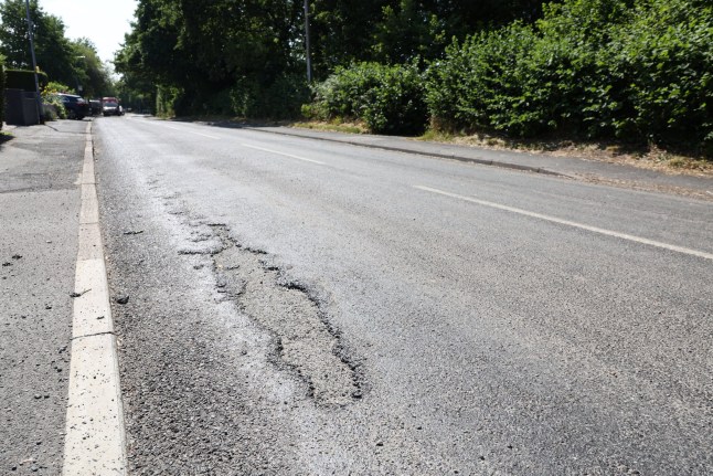 Gorsemoor Road in Cannock in Staffordshire is melting down in the heatwave. The highways authority has temporarily closed the road, and has been out on Saturday to treat it . Photo released 13/07/2025