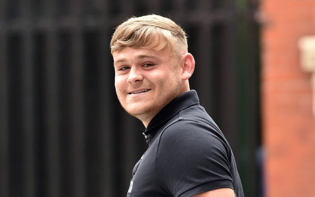 Manchester Magistrates Court Alfie Holt aged 20 smiles s he leaves Court after his sentence for the assault by slapping Manchester City player Jack Grealish after the derby match against Manchester United