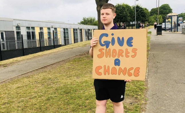 Photo of Derion Compson protesting shorts ban at Outwood Academy City in Sheffield. Pupils have staged a protest outside a secondary school after they were told they weren?t allowed to wear shorts during the third heatwave this year.Students at Outwood Academy City, in Sheffield, South Yorks., have been banned from wearing shorts but girls are allowed to wear skirts.Furious parents have now picketed outside the school after their children were turned away from the school gates or given detention for turning up to school wearing shorts.A total of 10 boys and five girls turned up outside the school on Monday, July 14, holding picket signs with messages including ?Free the Legs?, ?Give Shorts a Chance?, and ?Wearing Shorts Matters?. Photo released 14/07/2025