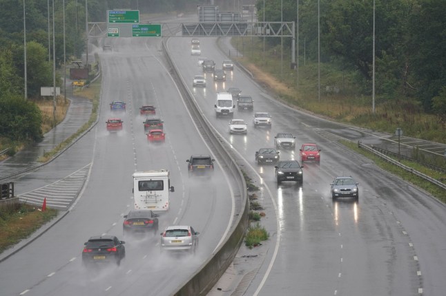 Motorists on the A46 near Coventry during rain showers. An amber weather warning has come into force with dangerous thunderstorms threatening to bring a weekend of flooding to parts of the UK. Picture date: Saturday July 19, 2025. PA Photo. Photo credit should read: Jacob King/PA Wire
