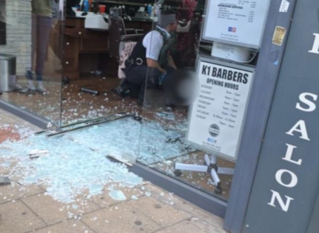 A serious incident on Sutton High Street has prompted a large response from the Metropolitan Police and London Ambulance Service, including an air ambulance landing nearby at Sutton Green. The incident reportedly occurred at around 2:10pm outside K1 Barbers, where witnesses saw a man with blood on his face and multiple visible injuries. Graphic photos from the scene show blood-stained rags, belts, and smashed glass outside the premises. Emergency Services Respond to Major Incident on Sutton High Street Police cordoned off a section of the High Street while emergency responders worked at the scene. Officers were seen entering K1 Barbers, with a strong visible presence along the street. Emergency Services Respond to Major Incident on Sutton High Street In the aftermath d blood issplattered across the pavement, adding to the growing concern among local residents and shoppers. At this stage, official details remain limited, and the nature of the incident???whether a stabbing, assault, or another form of violence???has not been confirmed. No arrests or updates on the victim's condition have been released. A spokesperson for Metropolitan Police said they are aware of the incident and a statement is expected. The London Ambulance Service has also been approached for comment.