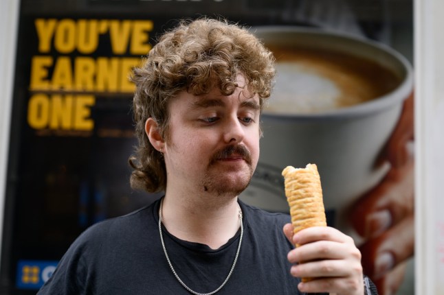 Metro reporter Josh Milton samples a Greggs sausage roll while exploring the large price disparity of sausage rolls in London?s bars and food outlets.