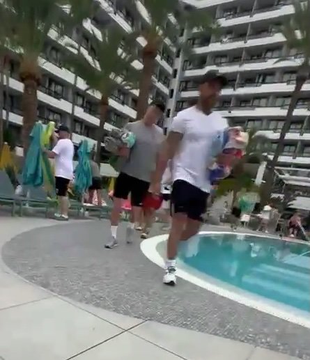 Story from Jam Press (Sunbed War Stampede) Pictured: A video grab of Liam and his friend, Paul, rushing for sun beds as a hotel worker almost got trampled by a stampede of guests. VIDEO: Hotel worker almost trampled by ?stampede? of guests rushing for sun beds A hotel worker was almost trampled by a ?stampede? of guests rushing to secure the best poolside sun beds. Shocking footage showed the security guard unlocking the gate before dropping his keycard. He was almost knocked over by clambering holidaymakers as he tried to retrieve the card before retreating to safety. The clip was captured at the four-star Spring Bitacora hotel in Tenerife. Liam Pourhana and his friend, Paul Nygaard, had front row seats to the shocking scene. The 34-year-old duo managed to get to the front of the queue by getting to the pool at 6:30am. Despite the area only opening at 8am, Liam said that over 100 people were waiting to get in. The pair of engineers from South Shields, Tyne and Wear, grabbed their loungers before watching the chaos unfold on Sunday (20 Jul). ?After paying ?5,000 to stay here, it?s a joke getting up earlier than you would for work,? Liam told Luxury Travel Daily. ?If you don?t get up and get in the queue, you?re not getting a sunbed. ?You have to queue from 6:30am, despite the pool gate not opening until 8am. ?About 100 people rushed towards the beds, some were even throwing towels over people's shoulders to beat them. ?The security guard dropped his card and didn?t want to risk the stampede.? ENDS EDITOR'S NOTE: Video Usage Licence: (EXCLUSIVE) We have obtained an exclusive licence from the copyright holder. A copy of the licence is available on request. Video Restrictions: None.