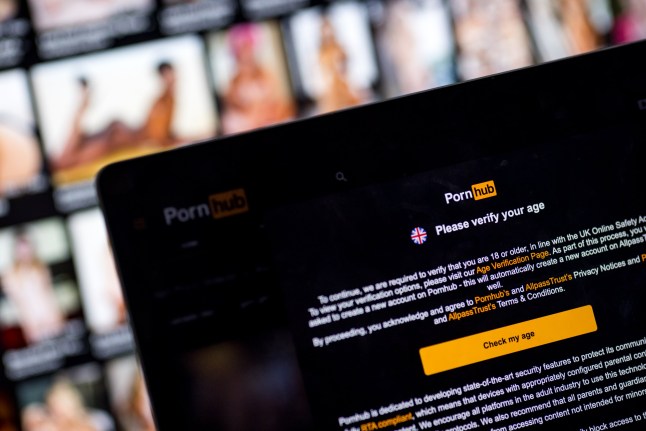LONDON, ENGLAND - JULY 25: In this photo illustration, the age-verification screen is displayed on the website Pornhub on July 25, 2025 in London, England. From today, the UK communications regulator Ofcom is compelling websites with pornographic material to introduce new age-verification measures for UK users. Aylo, the parent company of the website Pornhub, had criticised such age-verification measures, saying they would simply force users to darker corners of the web that do not require any age confirmation. (Photo by Jack Taylor/Getty Images)