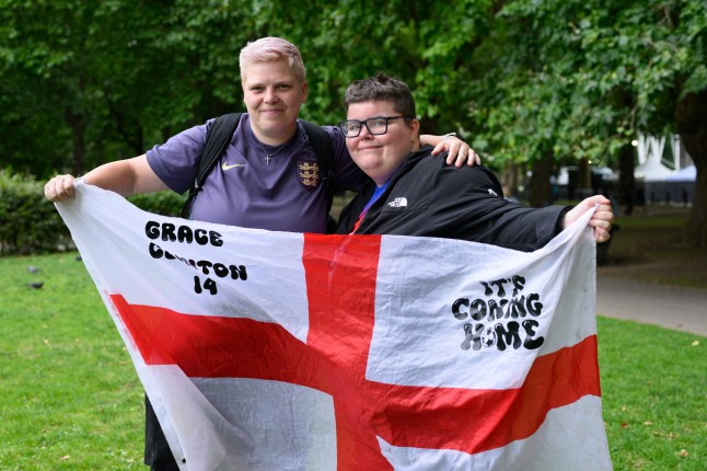 Supporters of the Euros-winning England women?s football team gather on the Mall for the open top bus parade.Photo shows Kayleigh Knipe-Thompson from Sheffield (left) and Ellie Green from Salford (right).