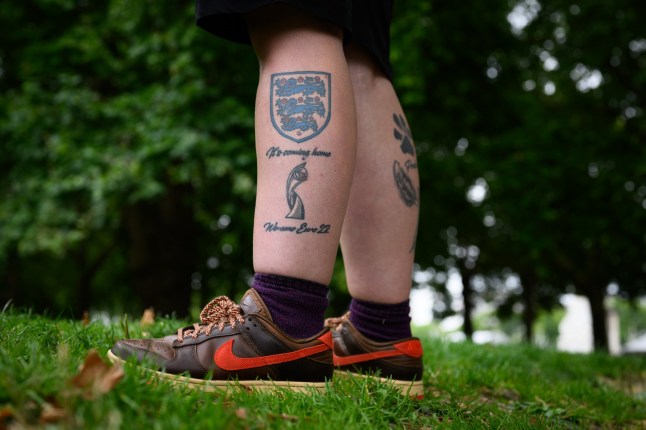 Supporters of the Euros-winning England women?s football team gather on the Mall for the open top bus parade.Photo shows a tattoo on the calf of Kayleigh Knipe-Thompson from Sheffield.