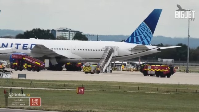 Multiple emergency vehicles surround United Airlines Flight UA949 due to smoke in cabin at London Heathrow Airport