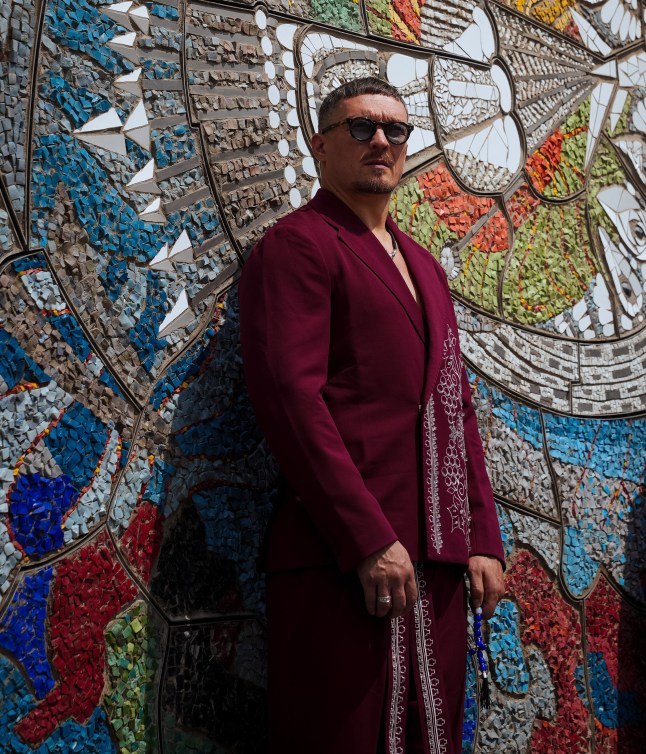 Oleksandr Usyk stands in front of a meticulous recreation of the symbolic mosaic reflecting Ukrainian identity (Picture: ROZETKA)