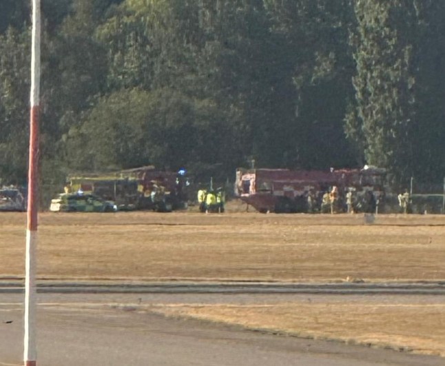 Emergency services are seen at the scene of London Southend Airport after the crash