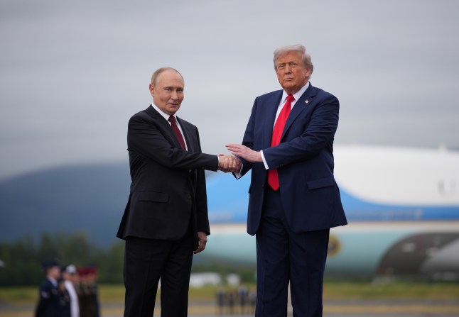 Putin and Trump shake hands in Alaska