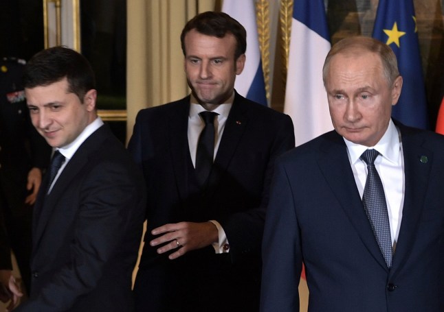 TOPSHOT - From L: Ukrainian President Volodymyr Zelensky, French President Emmanuel Macron and Russian President Vladimir Putin arrive for a meeting on Ukraine with German Chancellor at the Elysee Palace, on December 9, 2019 in Paris. - Russian president will for the first time hold formal talks with his Ukrainian counterpart over the conflict in Ukraine's east, at a much-anticipated summit in Paris. (Photo by Alexey NIKOLSKY / SPUTNIK / AFP) (Photo by ALEXEY NIKOLSKY/SPUTNIK/AFP via Getty Images)