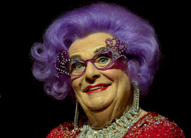 FILE - Australian TV presenter Barry Humphries performs on stage as Dame Edna for the Farewell Tour, at the London Palladium theatre, in central London, on Nov. 13, 2013. Tony Award-winning comedian Barry Humphries, internationally renowned for his garish stage persona Dame Edna Everage, a condescending and imperfectly-veiled snob whose evolving character has delighted audiences over seven decades, died on Saturday, April 22, 2023, after spending several days in a Sydney hospital with complications following hip surgery, a Sydney hospital said. He was 89 years old. (Photo by Joel Ryan/Invision/AP, File)