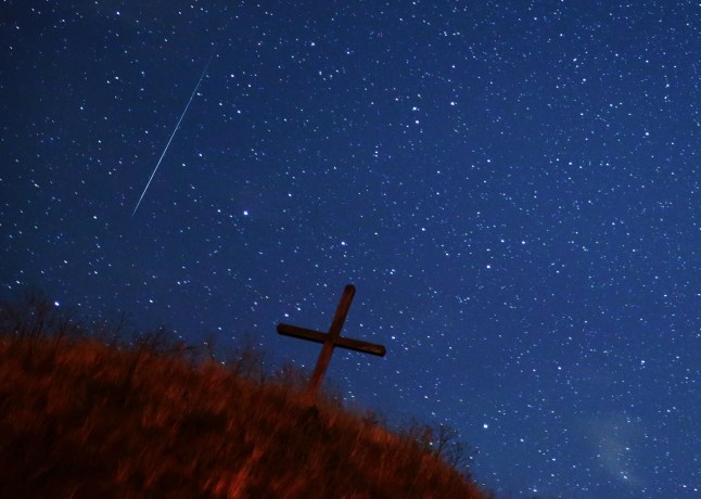 GROSSMUGL, AUSTRIA - AUGUST 13: A meteor streaks across the night sky above Leeberg hill during the Perseid meteor shower on August 13, 2023 in Grossmugl, Austria. (Photo by Heinz-Peter Bader/Getty Images) *** BESTPIX ***