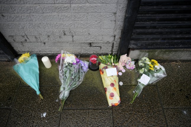 Flowers laid outside Hull funeral directors' offices.