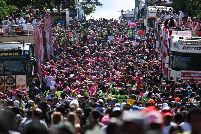 LONDON, UNITED KINGDOM - AUGUST 25: Thousands of people from all over the world crowd the streets during the Notting Hill Carnival, known as the largest street carnival in Europe, in London, United Kingdom on August 25, 2024. (Photo by Rasid Necati Aslim/Anadolu via Getty Images)