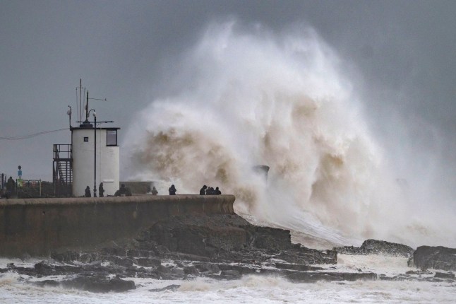 Waves crash against the harbour wall on December 7, 2024, in Porthcawl, Wales.