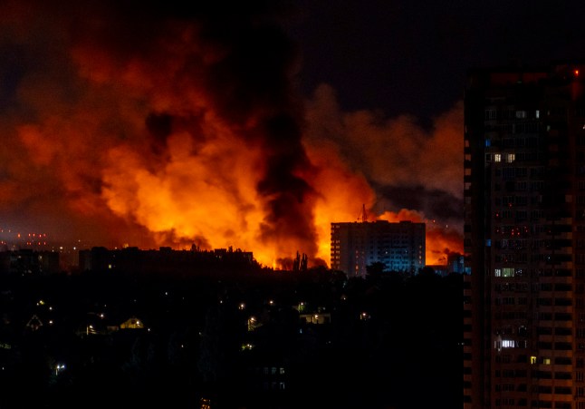 TOPSHOT - Flames and smoke billow from buildings during mass Russian drones and missile strikes on the Ukraine's capital on July 4, 2025, amid the Russian invasion of Ukraine. Ukraine said Russia had launched 550 drones and missiles at the war-battered country overnight, as the Kremlin steps up aerial attacks and US-led peace talks stall. The Ukrainian air force said Moscow had launched 539 drones and 11 missiles, adding that air defence units had downed 268 drones and two missiles. (Photo by OLEKSII FILIPPOV / AFP) (Photo by OLEKSII FILIPPOV/AFP via Getty Images)