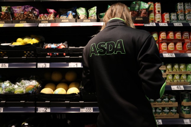 A worker checks stock at the Asda Express convenience store, operated by Asda Group Ltd., in London, UK, on Tuesday, Dec. 13, 2022. Asda is accelerating its push into convenience stores as the UK's third-largest supermarket operator seeks to expand its market share. Photographer: Hollie Adams/Bloomberg via Getty Images