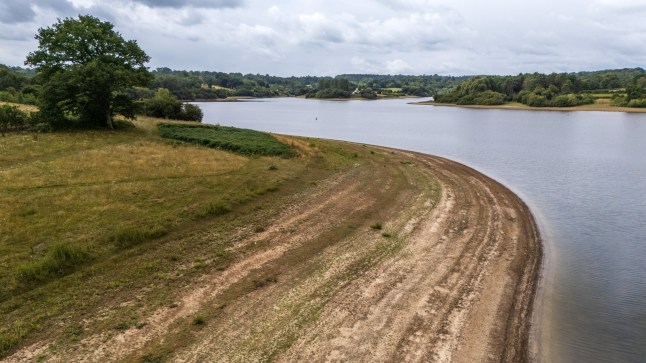 LAMBERHURST, ENGLAND - JULY 17: An aerial view showing Bewl Water reservoir sitting around 70% full on July 17, 2025 in Lamberhurst, England. In mid-May this year, Bewl Water reservoir was 86.4% full. However, following three Met Office-defined heatwaves throughout June and July, and Kent only receiving 35% of its expected rainfall, it now stands at 70%. Bewl Water supplies both Kent and Sussex with water, and hosepipe bans come into effect in these two counties as from tomorrow, July 18. (Photo by Carl Court/Getty Images)