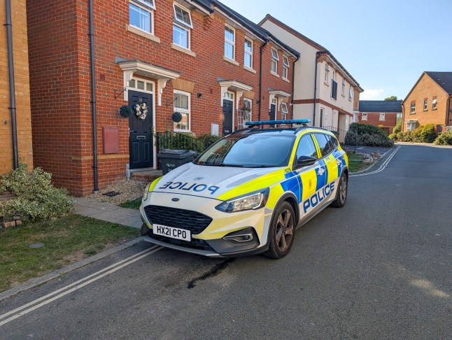 Police outside the home where a man and woman were arrested after a one-year-old baby was taken to hospital in a 'serious' condition.