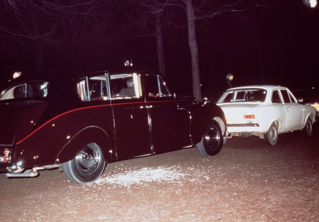 The aftermath of Ian Ball's attempt to kidnap Princess Anne, on The Mall, London, 20th March 1974. Ball's white Ford Escort is parked blocking the path of the Princess's Princess IV limousine. (Photo by Hulton Archive/Getty Images)