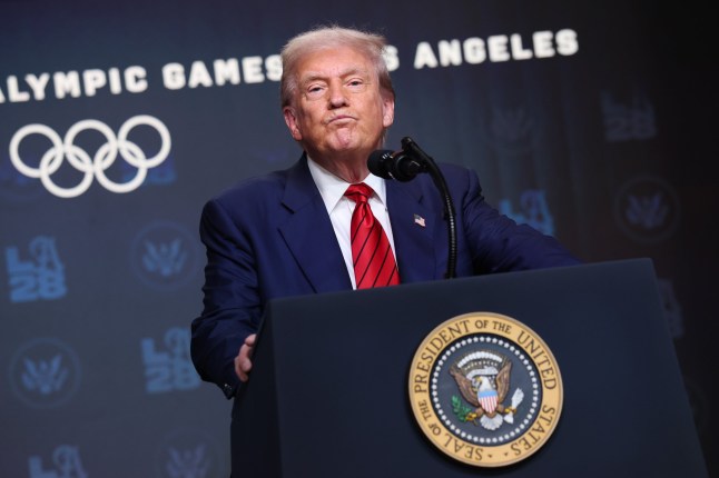 WASHINGTON, DC - AUGUST 05: U.S. President Donald Trump takes questions from reporters after signing an executive order in the South Court Auditorium in the Eisenhower Executive Office Building on August 5, 2025 in Washington, DC. The executive order creates a White House task force to help coordinate logistical issues related to the 2028 Summer Olympic Games in Los Angeles including security, visas for athletes and coaches and transportation. (Photo by Win McNamee/Getty Images)