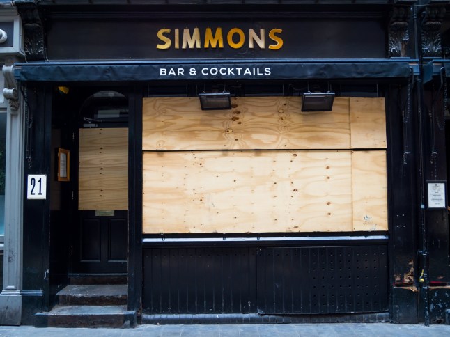 London, England. May 7th 2020: Simmonds bar and cocktails in Widegate Street, Spitalfields near Liverpool Street station, East London. Nightclub, music and drinks, closed due to lockdown. Boarded up.; Shutterstock ID 1725226042; purchase_order: -; job: -; client: -; other: -