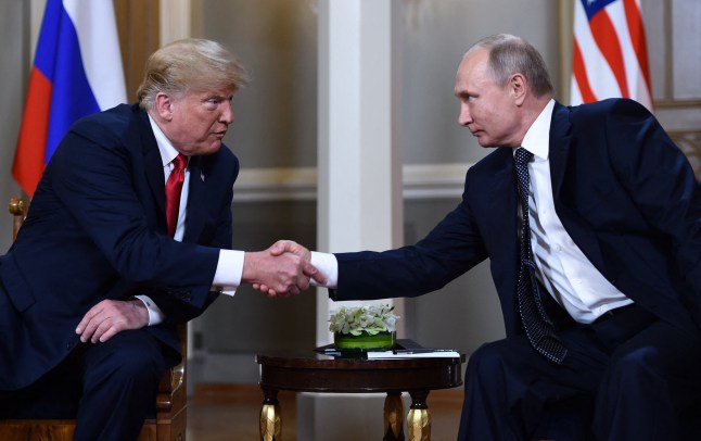 TOPSHOT - (FILES) Russian President Vladimir Putin (R) and US President Donald Trump shake hands before a meeting in Helsinki, on July 16, 2018. US President Donald Trump and Russian counterpart Vladimir Putin could meet for a summit as early as next week, the Kremlin said on August 7, 2025. The meeting would be the first between a sitting US and Russian president since Joe Biden met Putin in Geneva in June 2021, and comes as Trump seeks to broker an end to Russia's military assault on Ukraine. (Photo by Brendan Smialowski / AFP) (Photo by BRENDAN SMIALOWSKI/AFP via Getty Images)