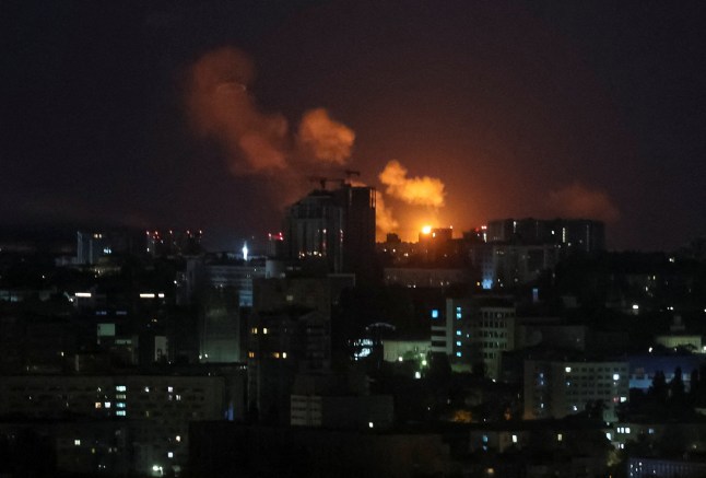 An explosion of a drone lights up the sky over the city during a Russian drone strike, amid Russia's attack on Ukraine, in Kyiv, Ukraine August 8, 2025. REUTERS/Gleb Garanich
