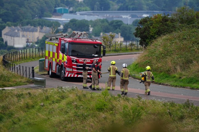 Crews from Scottish Fire and Rescue Service at the scene of a fire on Arthur's Seat in Holyrood Park, Edinburgh. Picture date: Sunday August 10, 2025. PA Photo. Photo credit should read: Jane Barlow/PA Wire