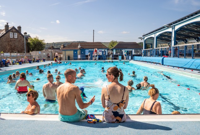 Swimmers at Hathersage open-air swimming pool, at Hope Valley in the Peak District, Derbyshire. Temperatures will soar above 30C in parts of the UK in the coming days, with another heatwave possible in some areas. Picture date: Monday August 11, 2025. PA Photo. Photo credit should read: Danny Lawson/PA Wire
