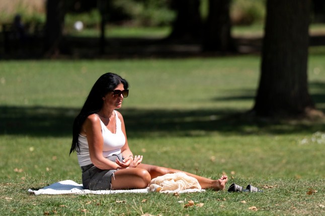 A person sunbathing in Barnes, London. Temperatures will soar above 30C in parts of the UK in the coming days, with another heatwave possible in some areas. Picture date: Monday August 11, 2025. PA Photo. Photo credit should read: Ben Whitley/PA Wire