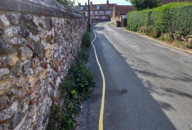 Council contractors made to repaint wonky yellow lines after locals' mocking