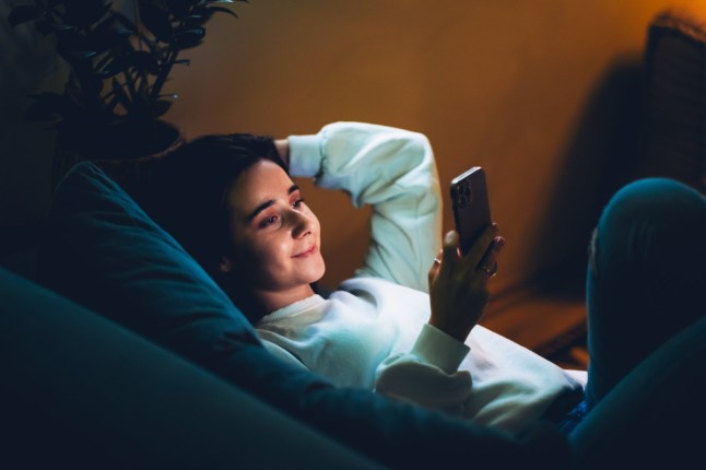 Digital leisure, nighttime screen use and relaxation after work concept.