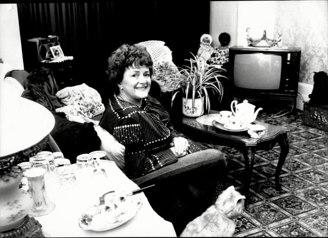 Mandatory Credit: Photo by Keith Waldegrave/ANL/Shutterstock (2117381a) Cynthia Payne Madam And Politician In Her Streatham Home Cynthia Payne (born 24 December 1932 In Bognor Regis West Sussex) Is A Retired English Party Hostess Who Made The Headlines In The 1970s And 1980s When She Was Accused (and Convicted) Of Being A Madam And Running A Brothel At 32 Ambleside Avenue In Streatham In The South-west Of London England. Payne First Came To National Attention In 1978 When Police Raided Her Home And Found A Sex Party Was In Progress. Elderly Men Paid In Luncheon Vouchers To Dress Up In Lingerie And Be Spanked By Young Women. When The Case Came To Trial In 1980 She Was Sentenced To Eighteen Months In Prison Reduced To A Fine And Six Months On Appeal. She Served Four Months In Holloway Prison. In 1986 The Police Raided Her Home Again This Time During A 'special Party' She Was Hosting After Shooting The Film Of Her Life Had Been Completed. Although She Was Acquitted On This Occasion The Resulting Court Case In 1987 Made Headlines For Several Weeks With Lurid Tales Some Details Of Which She Aired On The Dame Edna Experience In 1987 (s01 E06) With Co-guests Sir John Mills And Rudolf Nureyev Where She Also Launched Her Book Entertaining At Home. The Court Case Ended Her Career As A Party Giver. On This Programme She Expressed An Interest In Becoming An Mp In Order To Change Britain's Sex Laws Which She Followed Through By Standing For Parliament As A Candidate For The Payne And Pleasure Party In The Kensington By-election In July 1988 Followed By Her Standing In Her Own Area Of Streatham In The 1992 Uk General Election. She Did Not Gain A Parliamentary Seat. There Have Been Two Films Made That Are Loosely Based On Her Life. Wish You Were Here (1987) About Her Adolescence With Emily Lloyd In The Lead Role And Personal Services (also 1987) About Her Adult Life Starred Julie Walters. Both Were Written (and Wish You Were Here Was Directed) By David Leland. Cynthia Payne Ha...