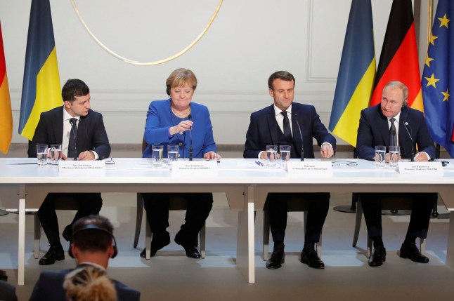 (FromL) Ukrainian President Volodymyr Zelensky, German Chancellor Angela Merkel, French President Emmanuel Macron and Russian President Vladimir Putin give a press conference after a summit on Ukraine at the Elysee Palace, in Paris, on December 9, 2019. Leaders aim for new withdrawal of forces from Ukraine conflict zones by March 2020, according to a communique on December 9, 2019. (Photo by CHARLES PLATIAU / POOL / AFP) (Photo by CHARLES PLATIAU/POOL/AFP via Getty Images)