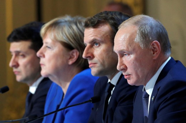 (L-R) Ukraine's President Volodymyr Zelenskiy, German Chancellor Angela Merkel, French President Emmanuel Macron and Russia's President Vladimir Putin attend a press conference after a summit on Ukraine at the Elysee Palace, in Paris, on December 9, 2019. Leaders aim for new withdrawal of forces from Ukraine conflict zones by March 2020, according to a communique on December 9, 2019. (Photo by CHARLES PLATIAU / POOL / AFP) (Photo by CHARLES PLATIAU/POOL/AFP via Getty Images)
