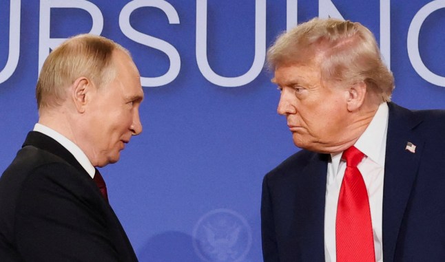 FILE PHOTO: U.S. President Donald Trump and Russian President Vladimir Putin look at each other during a press conference following their meeting to negotiate an end to the war in Ukraine, at Joint Base Elmendorf-Richardson, in Anchorage, Alaska, U.S., August 15, 2025. REUTERS/Kevin Lamarque/File Photo