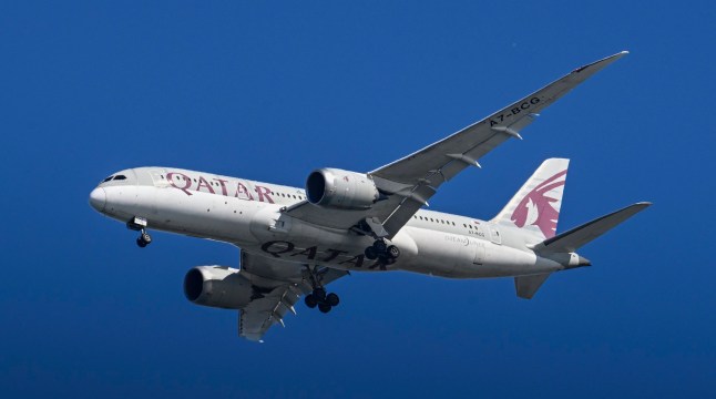 LISBON, PORTUGAL - JULY 27: A Qatar Airways aircraft flies over the Tagus River on her way to Humberto Delgado International Airport on July 27, 2025, in Lisbon, Portugal. Tourism in Portugal reached record figures in 2024, exceeding 27 billion euros in revenue, an increase of 8.8% compared to 2023. According to the Bank of Portugal (BdP), it grew in May by 6.1%, marking the first time it exceeded ???2.6 billion in the fifth month of the year. Cumulatively through May, tourism revenue in 2025 is already approaching ???10 billion. (Photo by Horacio Villalobos#Corbis/Corbis via Getty Images)