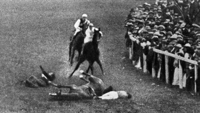 Suffragette Emily Davison is hit and killed by King George V's horse Anmer during the 1913 Epsom Derby. She fell underneath the galloping horse after leaping from the crowd and trying to grab hold the reins. (Photo by Hulton-Deutsch/Hulton-Deutsch Collection/Corbis via Getty Images)