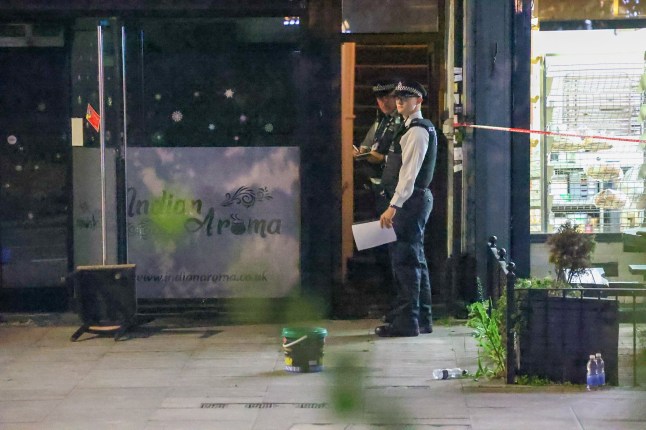 A major crime scene has been declared in Ilford after a restaurant was petrol bombed, leaving five people injured. Emergency services rushed to Woodford Avenue at around 9.04pm on Friday (22 August) following reports of a fire at the Indian Arma ??restaurant. Five Rushed to Hospital After Ilford Restaurant Petrol Bombed Five people injured London Ambulance Service confirmed that five people were treated for burns and smoke inhalation at the scene. Five Rushed to Hospital After Ilford Restaurant Petrol Bombed A spokesperson said: ???We were called at 9.04pm today (22 August) to reports of a fire on Woodford Avenue, Ilford. ???We sent resources to the scene, including ambulance crews, an advanced paramedic, an incident response officer and paramedics from our hazardous area response team. We also dispatched a trauma team in a car from London???s Air Ambulance. Five Rushed to Hospital After Ilford Restaurant Petrol Bombed ???We treated five people for burns and smoke inhalation. We took two patients to a major trauma centre and three others to local hospitals.??? Manhunt launched Detectives have launched a manhunt for the perpetrators, with the Metropolitan Police confirming that the blaze is being treated as arson with intent to endanger life. Five Rushed to Hospital After Ilford Restaurant Petrol Bombed The area around the restaurant has been sealed off with a large cordon, as forensic teams and fire investigators work through the night. Residents reported hearing a ???loud bang??? followed by scenes of panic as staff and diners tried to flee the smoke-filled restaurant. Police appeal The Met source said: ???This was a reckless and deliberate attack that has left several people seriously injured. We are conducting urgent enquiries to trace those responsible and ask anyone with information to come forward immediately.??? CCTV footage from the area is being reviewed, and officers have appealed to motorists with dashcam recordings to check their footag