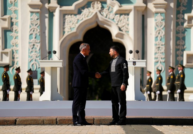 Canadian Prime Minister Mark Carney, left, and Ukrainian President Volodymyr Zelenskyy shake hands as they take part in a ceremony on Independence Day in Sophia Square in Kyiv, Ukraine, on Sunday, Aug. 24, 2025. (Sean Kilpatrick/The Canadian Press via AP)