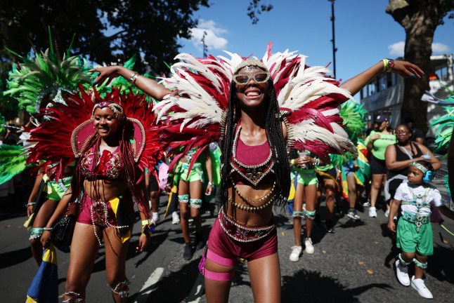 epa12319746 Participants during the Notting Hill Carnival Children's Day Parade in London, Britain, 24 August 2025. The Notting Hill Carnival is the largest street carnival in Europe. It is a community-led celebration of Caribbean history and culture. This year, it will run from August 25 to 26. Sunday is traditionally the children's carnival day. EPA/ANDY RAIN .