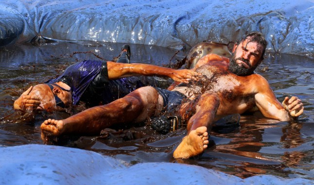 Fighters compete at the World Gravy Wrestling Championships at the The Rose ?N? Bowl in Rossendale. Points are scored on fun moves, costumes and how much you can make the crowd laugh. Photo released 25/08/2025